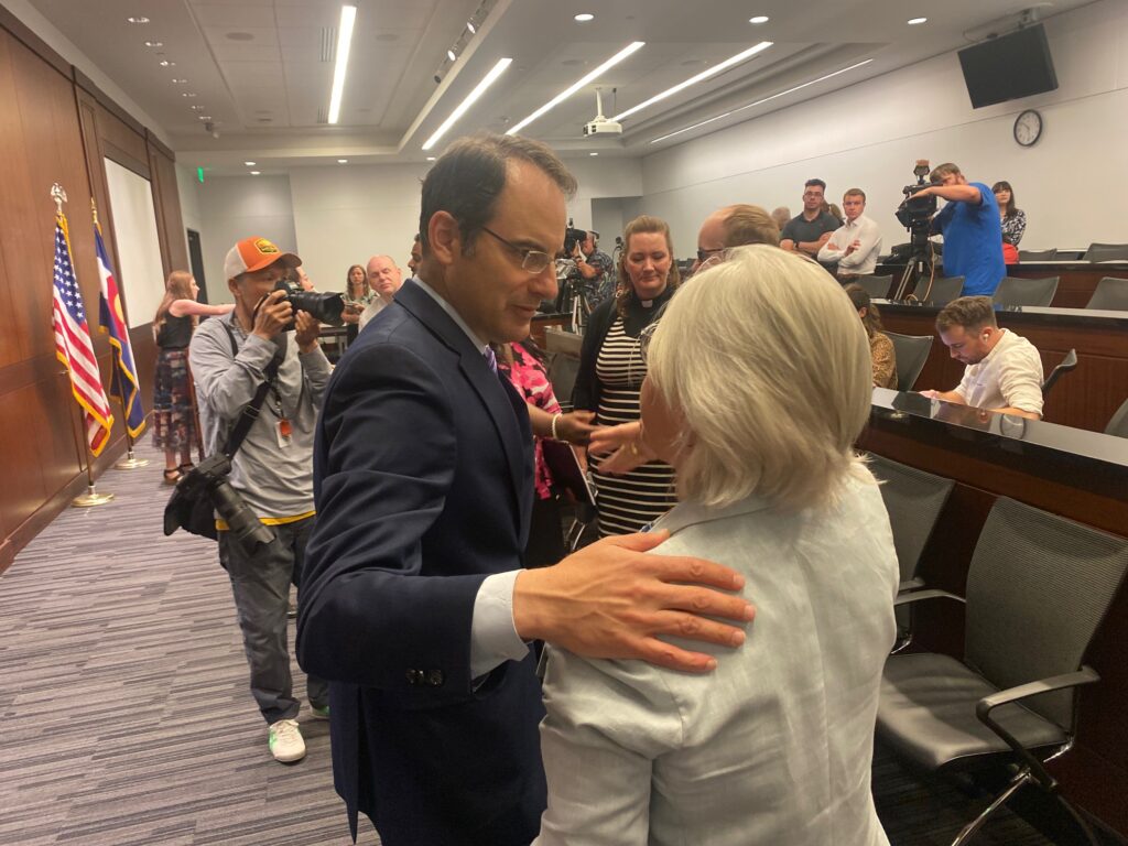 PICT Colorado Attorney General Phil Weiser, left, greets Out Boulder County Executive Director Mardi Moore after giving remarks on the U.S. Supreme Court's 303 Creative ruling, June 30, 2023. Quentin Young/Colorado