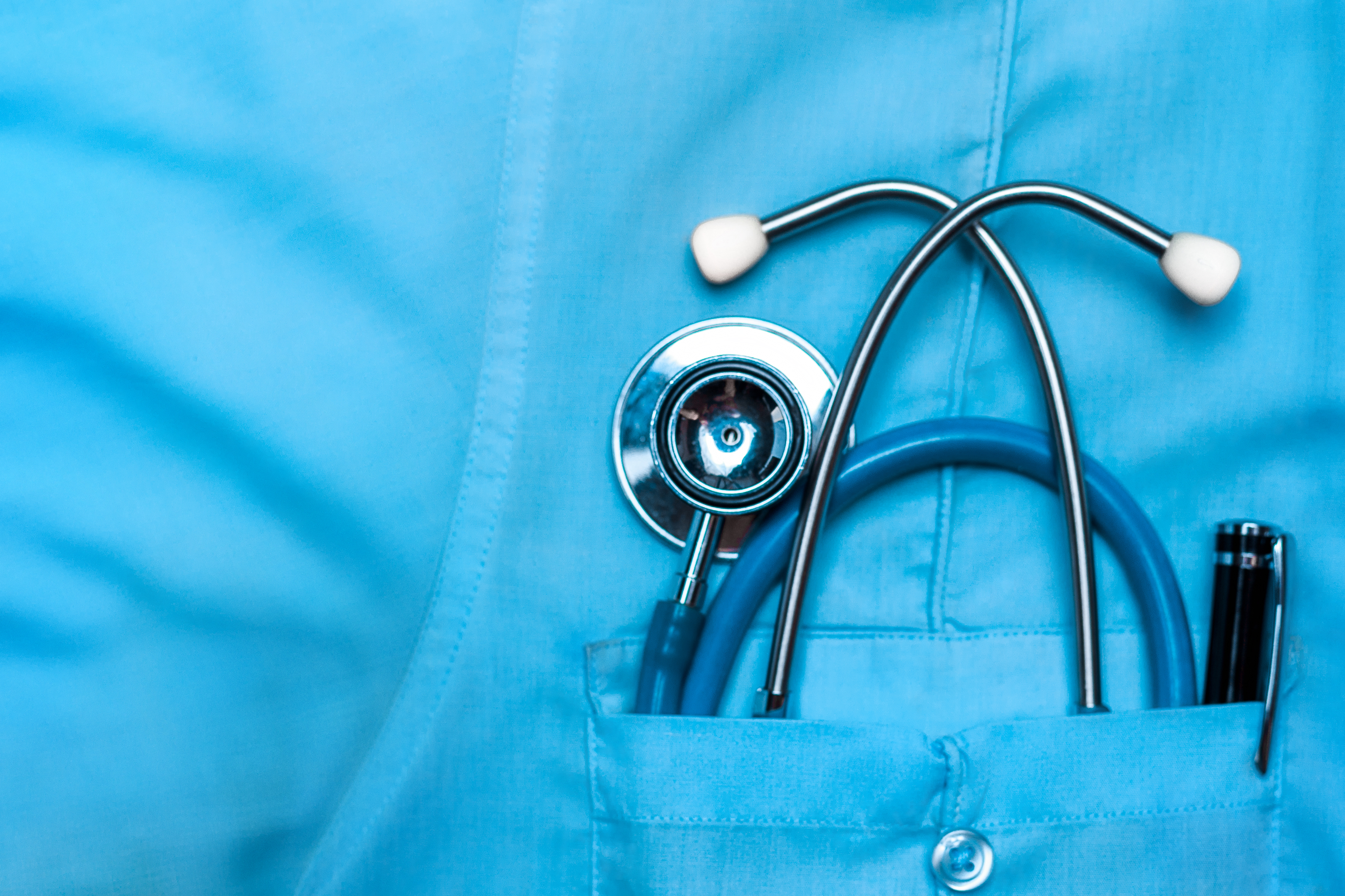 Closeup of a medical uniform with a stethoscope in a pocket