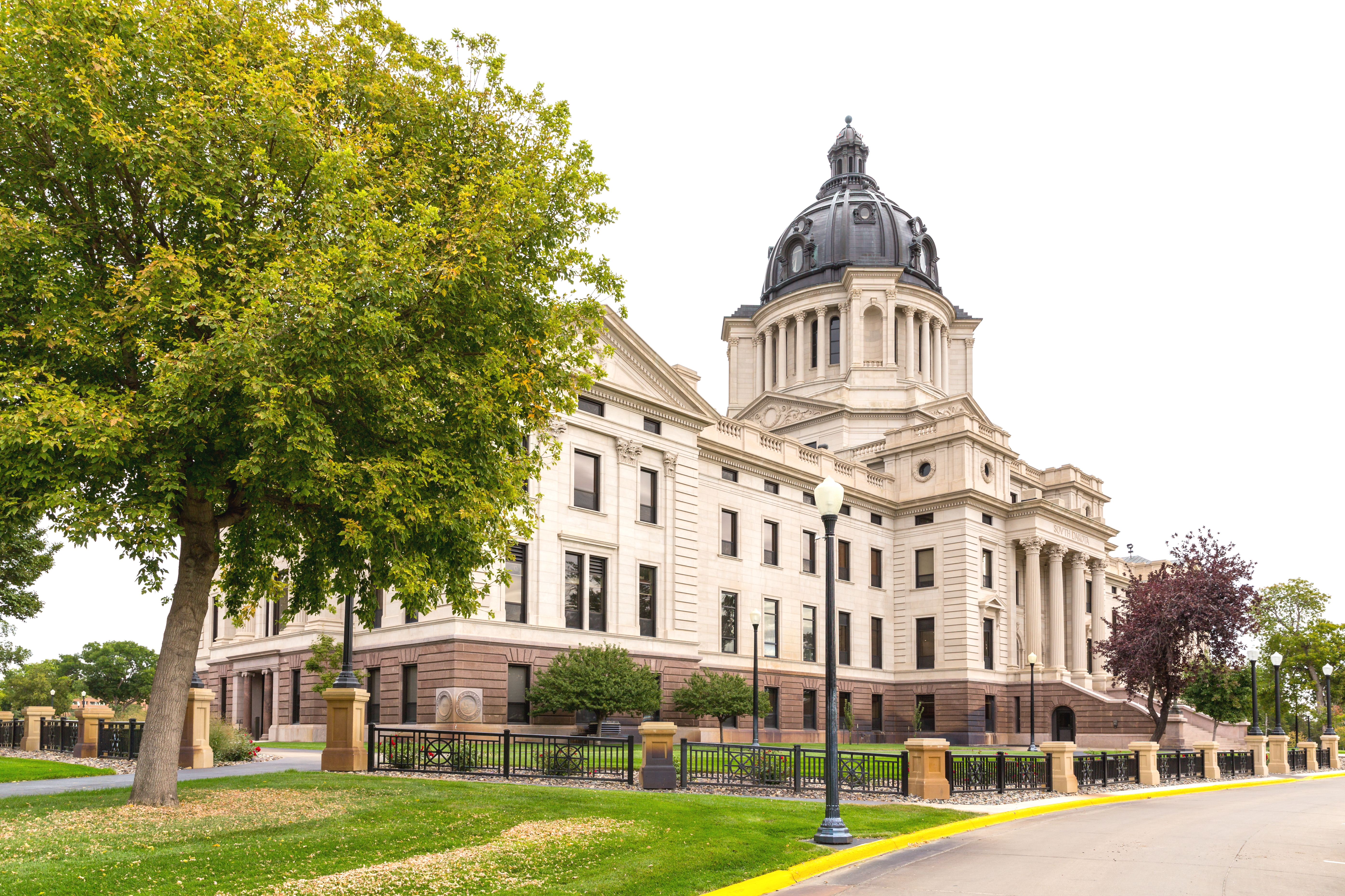 View of the front of the South Dakota State Capitol Building from an angle.