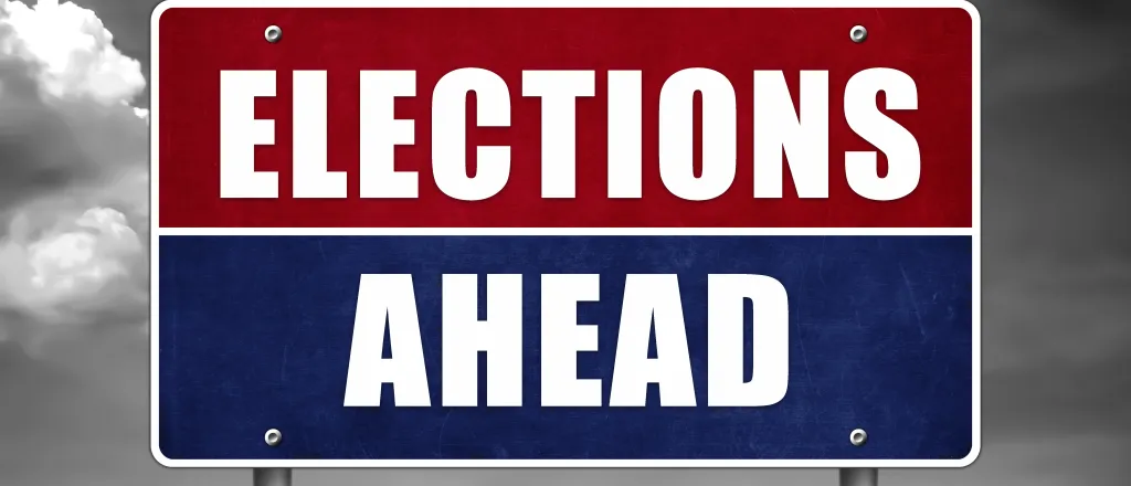 Roadside-style sign with the words "Elections Ahead"