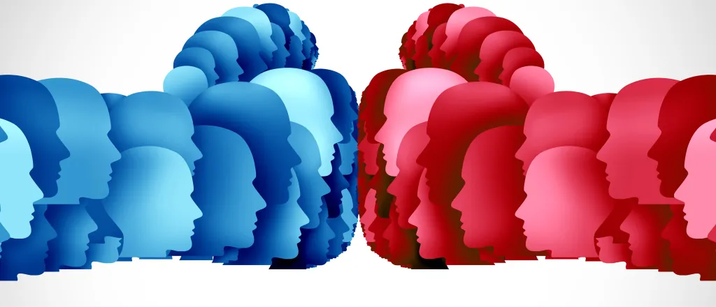 Concept image of two fists shaped from cutouts of a human head profiles colored in shades of red and blue.