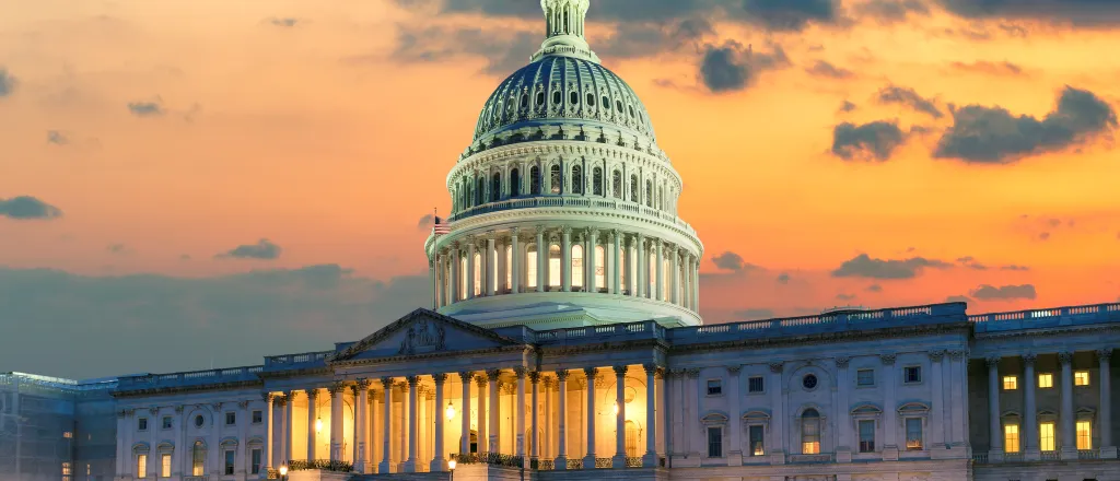 View of the west front door of the United States capitol building at sunrise