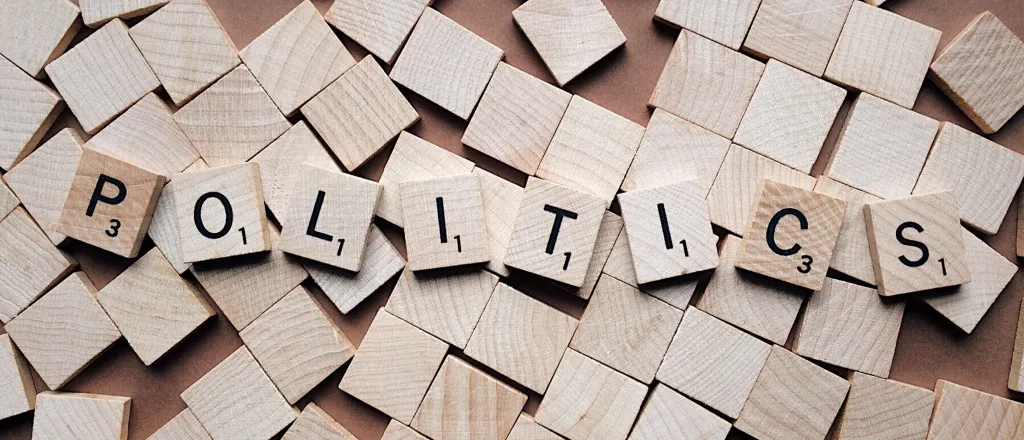 Wooden tiles spelling out the word "politics"