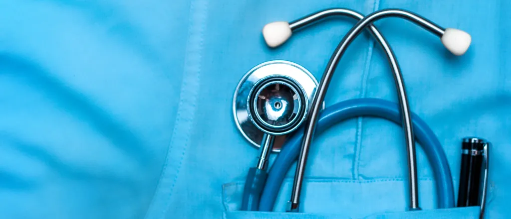 Closeup of a medical uniform with a stethoscope in a pocket