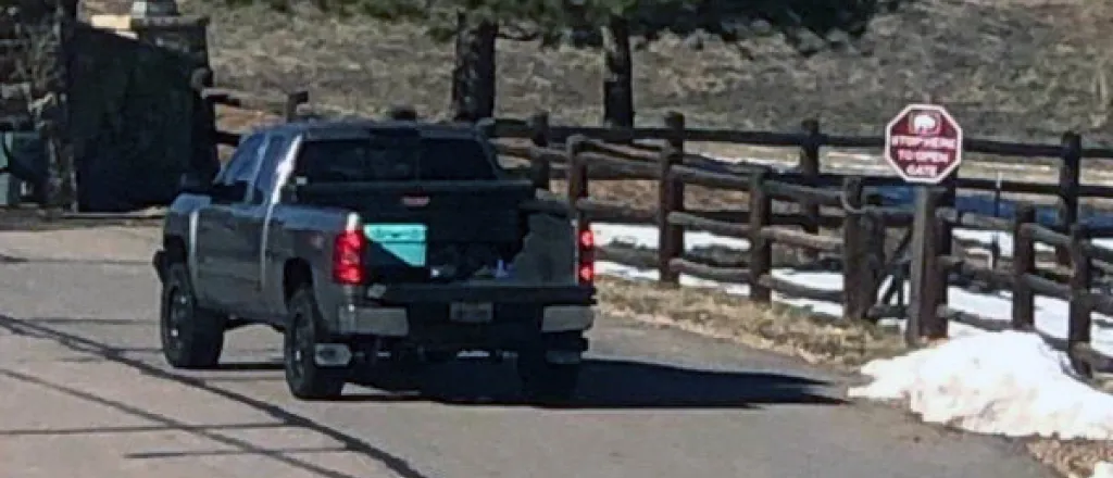 Suspect pickup on a roadway facing away from the camera.