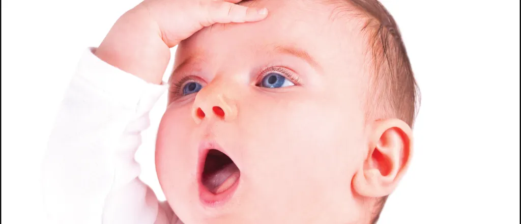 Baby with its hand on is forehead and mouth open. The Kiowa County Press logo with the words "Original image is no longer available" are near the baby