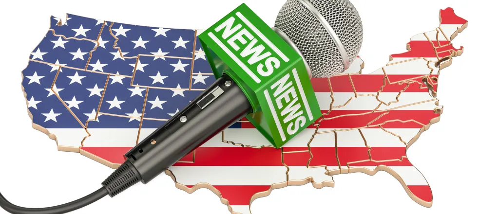 Microphone with the the word "news" on top of a puzzle map of the United States overlayed with the national flag.