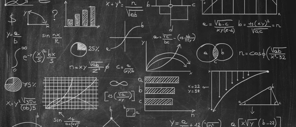 PROMO HIRES Academics - Chalk Board Science Education Graph Chart - iStock - Minerva Studio Chalk board with formulas, graphs, and charts.