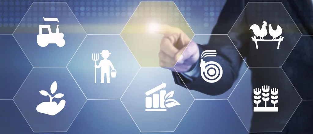 PROMO HIRES Agriculture - Generic Symbols Finger Point - iStock - denizbayram Person dressed in a suit pointing towards agriculture symbols in the foreground.