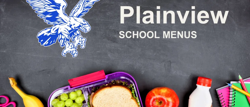 The Plainview School Hawks mascot, chalked on a blackboard above a packed school lunch of a sandwich, grapes, carrots, an apple and a bottle of milk, with pencils and notebooks. The board reads “Plainview School Menus”.