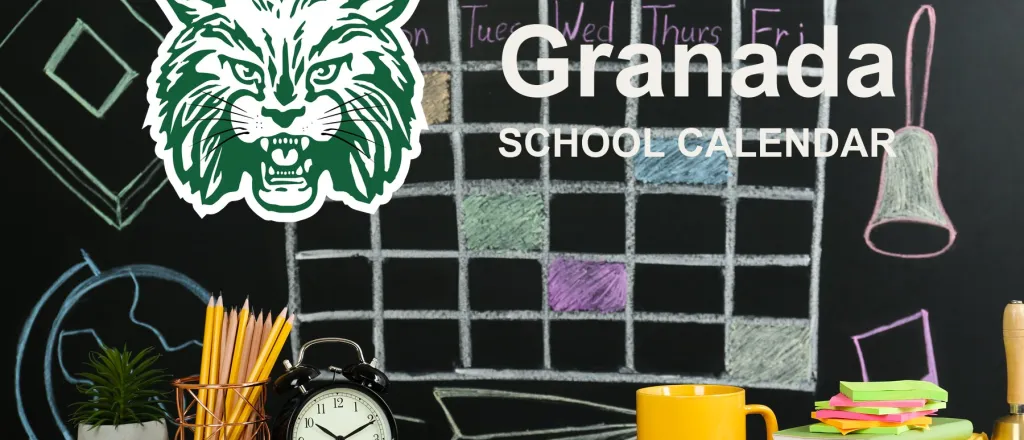 The Granada School Bobcats mascot, beside a chalkboard drawn with a weekly calendar grid above a desk of pencils, a clock and notebooks. The board reads “Granada School Calendar”.