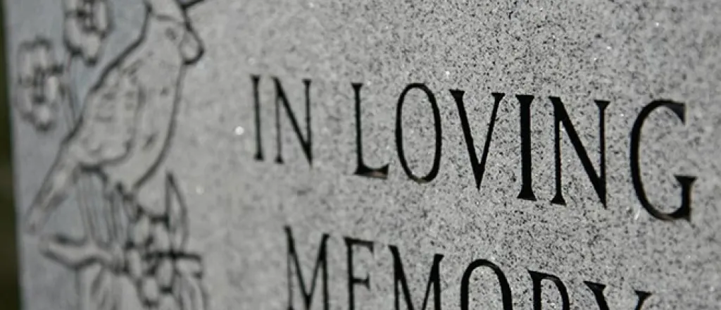 Obituary - Grave Marker In Loving Memory - iStock - melissarobison