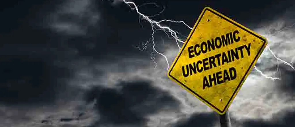 PROMO Economy - Sign Economic Uncertainty Ahead Inflation - iStock - ronniechua