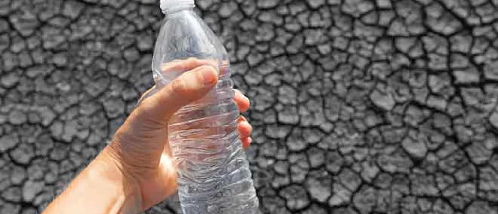 Miscellaneous - Drought Water Bottle Cracked Mud - iStock - kieferpix