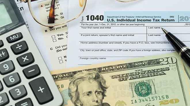 PROMO 64J1 Government - Tax Form Calculator Money - iStock PROMO Government - Tax Form Calculator Money - iStock
