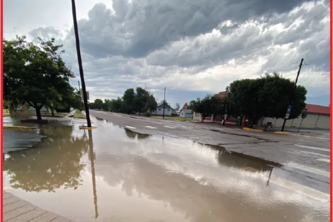 Photo of the Week - 2022-07-29 - Curb-high rain water flowing in Eads, Kiowa County - Chris Sorensen