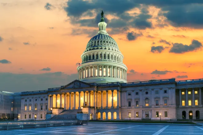 View of the west front door of the United States capitol building at sunrise