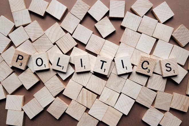 Wooden tiles spelling out the word "politics"