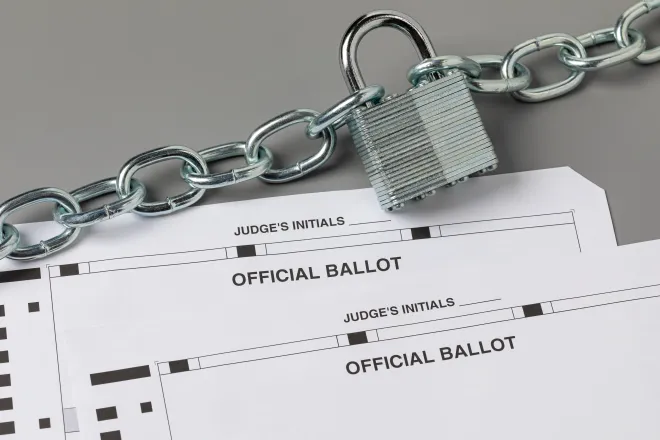 Two election ballots with a padlock and chain representing election security