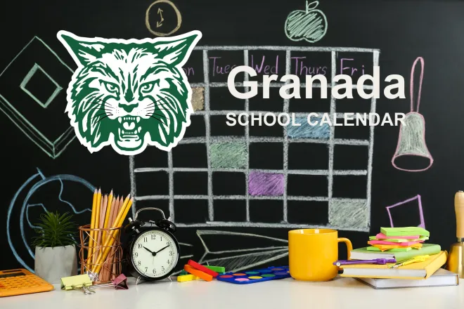 The Granada School Bobcats mascot, beside a chalkboard drawn with a weekly calendar grid above a desk of pencils, a clock and notebooks. The board reads “Granada School Calendar”.