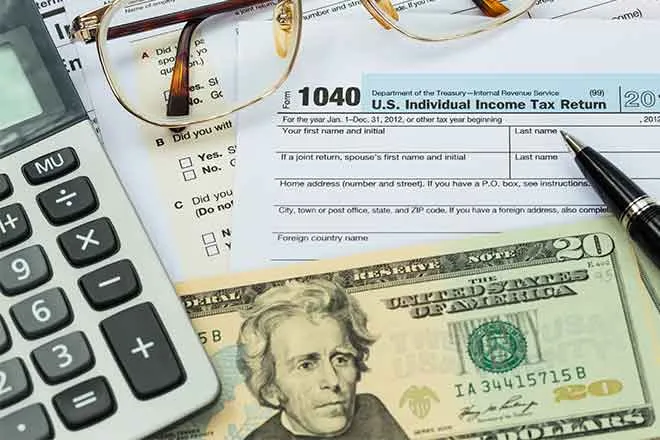 PROMO 660 x 440 Money - Tax Form Calculator Money Glasses - iStock PROMO 660 x 440 Money - Tax Form Calculator Money Glasses - iStock