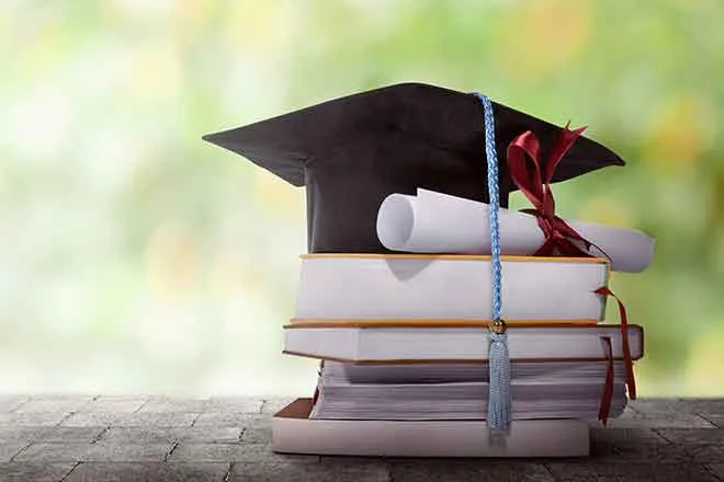 PROMO 64J1 Education - Graduation Cap Diploma Books - iStock - leolintang PROMO Education - Graduation Cap Diploma Books - iStock - leolintang
