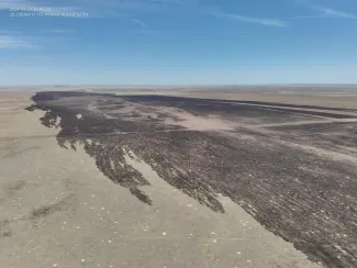Aerial view of fire-scorched prairie in Kiowa County, Colorado. Aerial view of fire-scorched prairie in Kiowa County, Colorado.