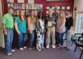 Members of the Kiowa County Department of Social Services receiving a performance award.