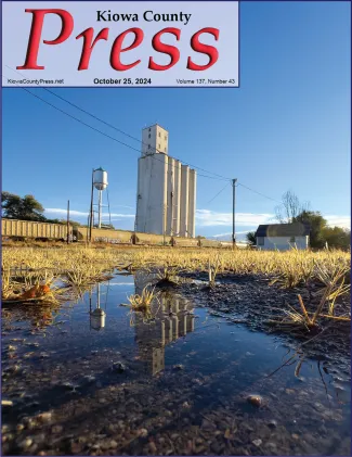 Grain elevator in Eads reflected in a rare puddle of rain water. - Chris Sorensen.