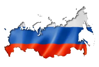 Russian flag showing through an overlaying cutout of the country