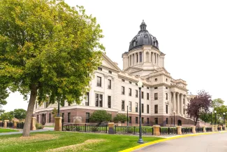 PROMO HIRES Building - Government South Dakota State Capitol - 4nadia - iStock-1444857682 View of the front of the South Dakota State Capitol Building from an angle.