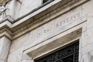 PROMO HIRES Finance - Goverment Bank Federal Reserve Building - iStock pabradyphoto Stone building with the words "Federal Reserve" over a doorway