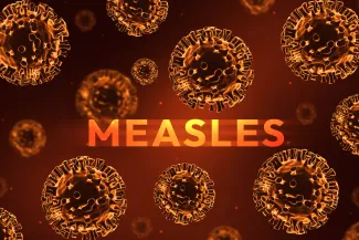 PROMO HIRES CROPPED Health - Measles Virus - Muhammad Farhad - iStock-2202501869 Concept artwork of viruses with the word "Measles."