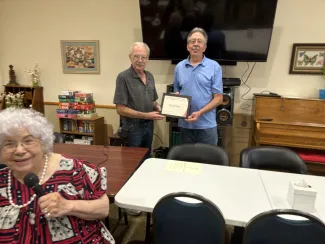 Ken Flory, right, receives the 2024 Volunteer of the Year plaque from Eads Chamber of Commerce President Dennis Pearson. Left: Doris Lessenden Ken Flory, right, receives the 2024 Volunteer of the Year plaque from Eads Chamber of Commerce President Dennis Pearson. Left: Doris Lessenden