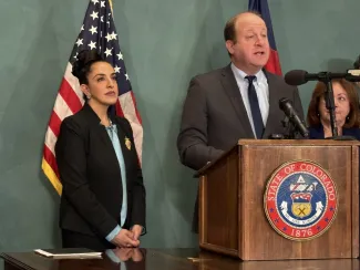 Colorado Supreme Court Justice Susan Blanco and Colorado Governor Jared Polis - Colorado Newsline