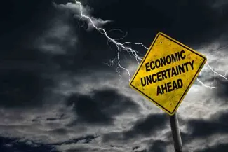 PROMO 64J1 Economy - Sign Economic Uncertainty Ahead Inflation - iStock - ronniechua PROMO Economy - Sign Economic Uncertainty Ahead Inflation - iStock - ronniechua