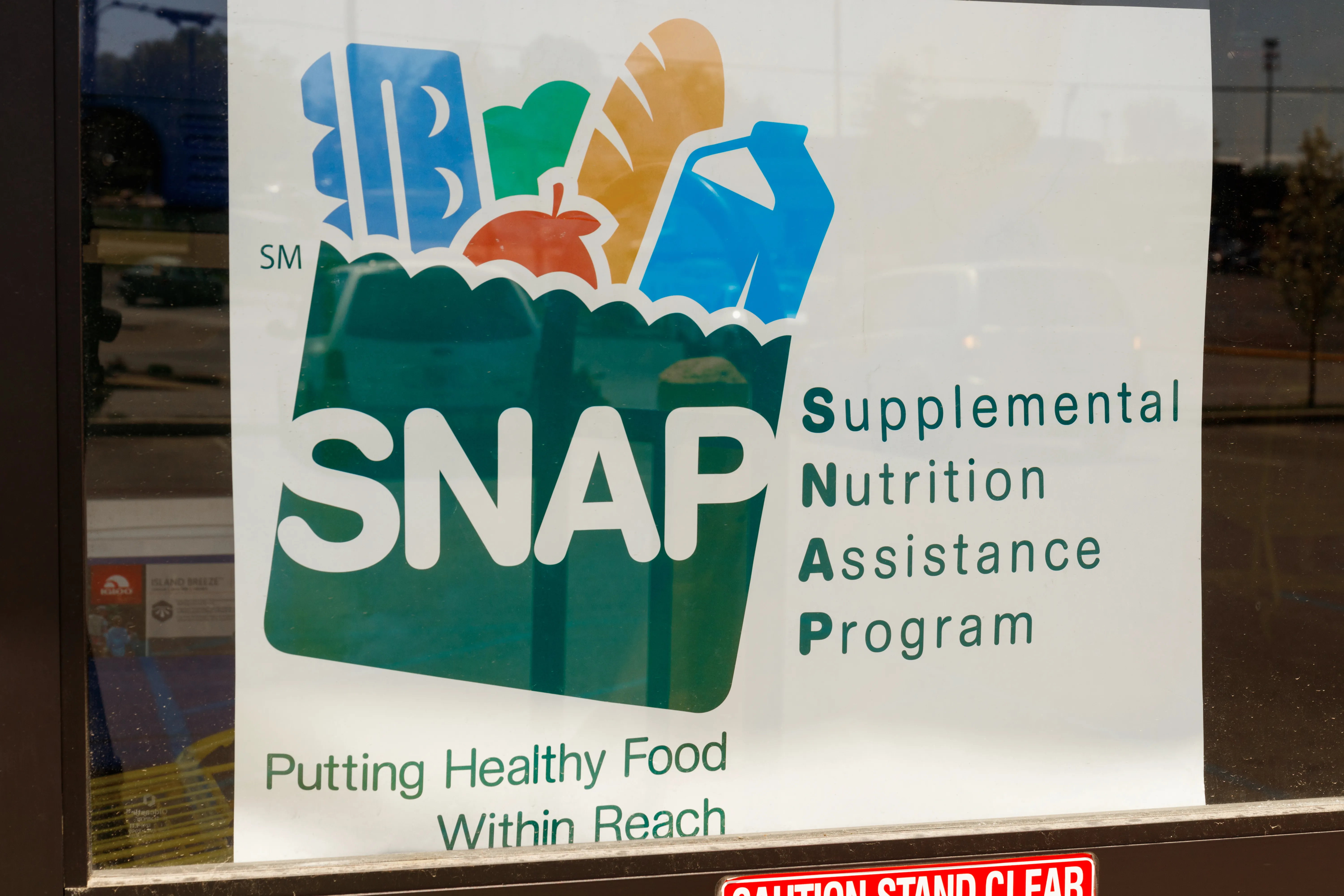 Photo of a sign the Supplemental Nutrition Assistance Program (SNAP) in a store window.