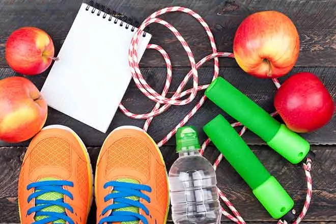 Health - Fitness Shoes Water Bottle Apple Jump Rope Note Pad - iStock - LanaSweet 