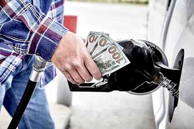 PROMO 64J1 Energy - Gasoline pump fuel money cash transportation - iStock - wingedwolf