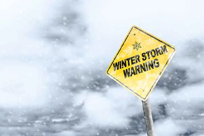 PROMO Weather - Sign Winter Storm Warning Snow Ice - iStock - ronniechua