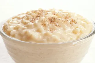 Glass bowl of rice pudding.