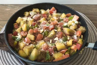 Pan of Fall Veggie Casserole on a pad.