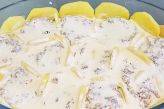 Potato Beef Casserole - USD Baking dish with potato beef casserole ready to cook.