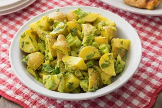 Potato Salad - USDA Bowl of potato salad on a checkered cloth.