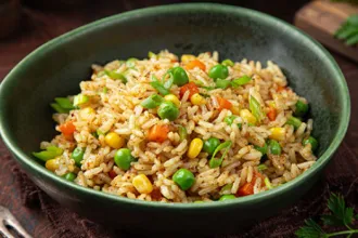 Vegetable Fried Rice - USDA Rounded bowl with three semi-flattened sides of vegetable fried rice.