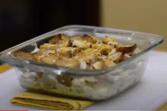 Glass casserole dish of leftover turkey casserole.